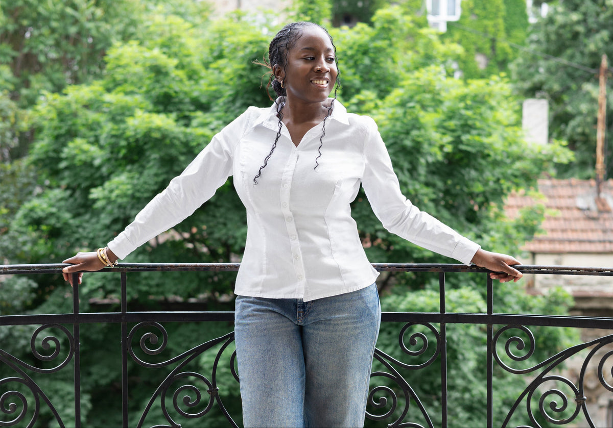 Model wearing The One and Only Shirt, a button-down with extra room for a fuller bust | Exclusively Kristen