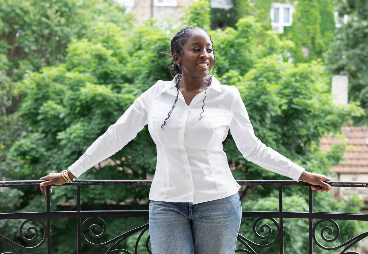 Model wearing The One and Only white button-down shirt, tailored with extra room for a fuller bust | Exclusively Kristen